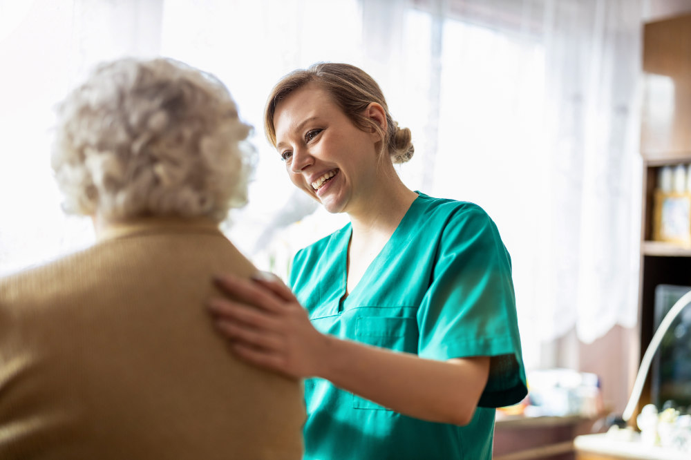 A nurse assisting a patient in a wheelchair.