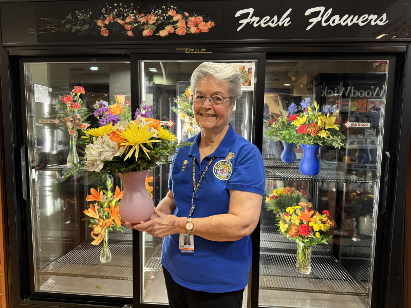 Gift Market Volunteers with Flowers